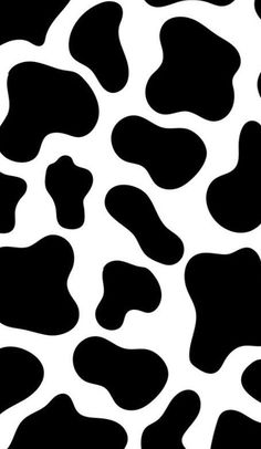 a black and white animal print pattern that looks like it has spots on the skin