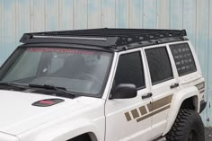 a white jeep parked in front of a building