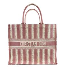 Christian Dior - Excellent - Book Tote D-Stripes Embroidery - Pink - Handbag Description Two Rolled Canvas Straps Canvas Canvas Lining Open Tote Measurements Width: 16.5 In / 41.91 Cm Height: 13.5 In / 34.29 Cm Depth: 6 In / 15.24 Cm Handle Drop: 6.5 In / 16.51 Cm Details Made In: Italy Color: Pink Material: Canvas Condition Excellent Yellow Stain On Front Authenticated By: Entrupy We, At Bougiehabit Ensure Each Item Is First Run Through A Thorough Authentication Process Before Being Approved To Be Listed. This Guarantees That We Only Sell What Is Authentic - So You Buy With Confidence. Indulge In The Luxury Experience. Talk To Us We Understand How Important This Purchase Is To You An Dior Book Tote, Pink Handbags, Medium Tote, Replica Handbags, Hermes Bag, Casual Backpack, Handbag Accessories, Womens Backpack, Christian Dior