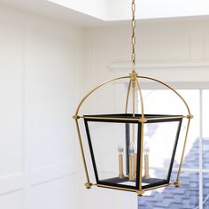 a light fixture hanging from the ceiling in a room