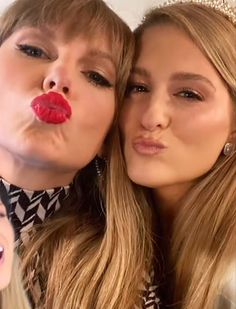 two beautiful young women with red lipstick on their lips