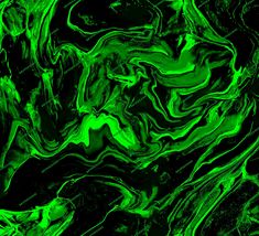 an abstract green and black background that looks like liquid or paint on the surface,