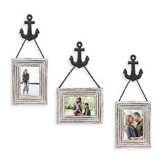 three frames with an anchor hanging on the wall