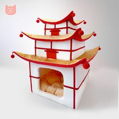 three red and white pagodas on top of each other with a bed in the middle