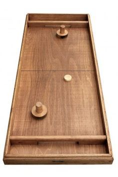 a wooden tray with two knobs on the front and one button on the back