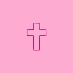 a pink wall with a cross on it