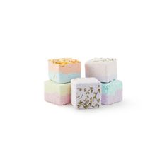 Spa days always leave us wondering, "Where in my house should the aromatherapy steam room go?" Hold off on renovating, because these cubes fill your shower with soothing essential oil scents like lemongrass and lavender. Boxed like a selection of sweets, the shower steamers gift set turns bath time into a deliciously pampering ritual. Handmade in California. Looking for earthier scents? Try our exclusive Invigorate Shower Steamers. | Calming Shower Steamers Gift Set - Set Of 5 | Wellness Gifts, Unusual Gifts For Women, Spa Days, Vegan Ingredients, Uncommon Goods, Earthy Scent, Arbour Day, Shower Steamers, Essential Oil Scents, Steam Room