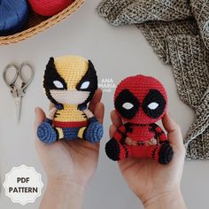 two small crocheted figurines in the shape of superheros