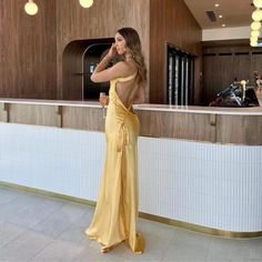 Jessica Gold Silk Maxi Dress - Shop Now - Aunomay Gold Dress Silk, Elegant Yellow Dress For Date Night, Elegant Yellow Maxi Dress For Prom Season, Yellow Satin Gown For Party, Yellow Fitted Satin Gown, Yellow Satin Party Gown, Gold Satin Summer Dress For Formal Occasions, Gold Satin Dress For Summer Formal Events, Chic Fitted Gold Gown