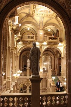 a statue in the middle of a large building