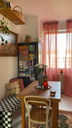 a dining room with a table and chairs