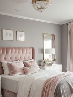 a bedroom with pink and gray decor