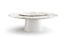 a white pedestal with a marbled surface on the top and two plates on it