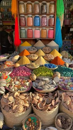 many baskets filled with different types of food on top of each other in front of a store