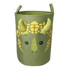 a green and yellow toy basket with an animal face on it