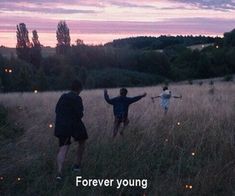 three people standing in a field with their arms out and the words just because the past taps on your shoulder doesn't mean you have to look back