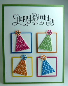 a birthday card with three colorful paper hats