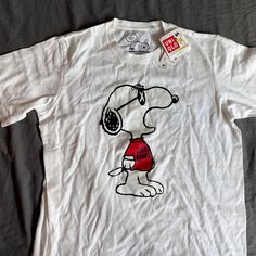 Please Note This Is New With Tags, But There Is Some Minor Yellowing On The Inner Collar. Please Note It Is Not From Wear. Relaxed Fit Cotton Tops With Cartoon Print, Relaxed Fit Cotton Top With Cartoon Print, Cotton Tops With Cartoon Print In Relaxed Fit, Kaws Snoopy, Snoopy Clothes, Kaws White, Heart Tee Shirt, Uniqlo Shirt, Vintage Snoopy