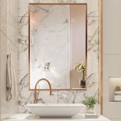 a white sink sitting under a bathroom mirror next to a counter top with a bowl on it