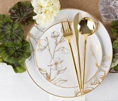 a white plate topped with two golden forks