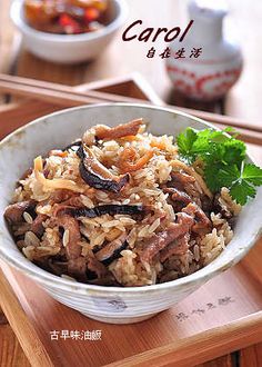 a white bowl filled with food on top of a wooden tray