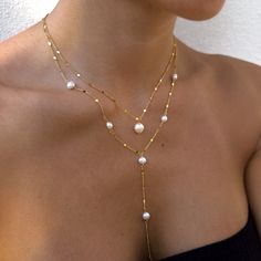 "Our gorgeous freshwater pearl necklaces make the perfect bride, bridesmaid, friend, family gifts. Delicately and carefully handmade with the most excellent and sparkling chain. The dainty minimalist chain dazzles along with our freshwater pearls.  We have the single pearl necklaces or long lariat-style necklace. Each are sold separately.  Wedding/Bridesmaids Discounts:  We offer discounts for multiple pieces, just send us over a message and we will gladly help! We can also put together a gorgeous gift box for your loved ones.  Single Pearl Necklace Length: 16 inches with extra 2\" chain extender Material: Stainless Steel Finish: 18K Gold Plating / Platinum Plating -  PROCESSING TIME -  This piece is handmade to order and is ready to ship in 1-2 business days.  - ABOUT MINKKSI -  https://w Boho Bride Necklace, Long Y Necklace, Elegant Lariat Jewelry For Wedding, Elegant Single Strand Lariat Necklace For Wedding, Delicate Lariat Necklace With Pearl Drop For Gifts, Delicate Pearl Necklace As Gift, Dainty Pearl Drop Necklace For Party, Delicate Pearl Chain Necklace As Gift, Minimalist Akoya Pearl Necklaces For Wedding