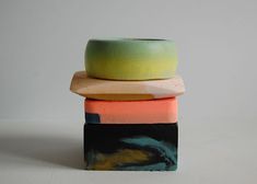 a stack of three ceramic bowls sitting on top of each other