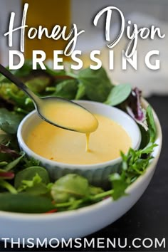 a spoon full of honey dijon dressing in a bowl