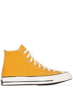 If it ain't broke, don't fix it. These classic yellow canvas Chuck Taylor 70 high top sneakers from Converse are an iconic shoe that transcends trends, seasons and will seamlessly fit into your wardrobe. There's no way these shoes are a bad option for you. Featuring a round toe, a contrasting toe cap, stitched panels, a lace-up front fastening, eyelets, a logo to the outside, branded heel counter and a flat rubber sole. Converse Chuck Taylor 70, Chuck Taylor 70, Gold Sneakers, Bag Women Fashion, Converse Chuck 70, Chuck 70, Converse Sneakers, Blue Sneakers, Espadrille Shoes