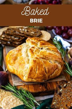 baked brie on a cutting board surrounded by bread, crackers and other foods