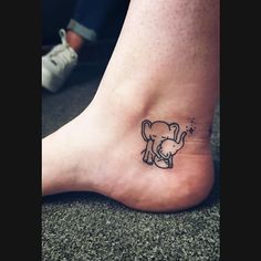 a small elephant tattoo on the ankle