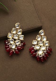 Alloy Based Earrings in Red and Off White This Pair is Adorned with Kundan and Beads Its Approximate Length is 0.5 inch Earrings For Red Dress, Red Earrings Indian, Red Kundan Jewellery, Kundan Earrings Jhumkas, Kundan Jhumka Earrings, Diy Earrings Materials, Festival Jewellery, Flower Jewelry Designs, Handmade Jewelry Business