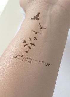 a woman's arm with birds on it and the words, to those who fly