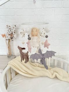 a baby crib with stuffed animals and decorations