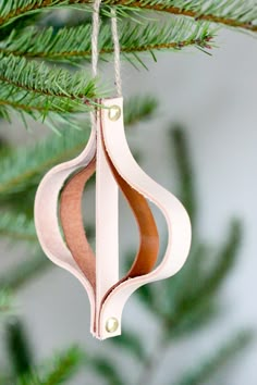 a wooden ornament hanging from a christmas tree