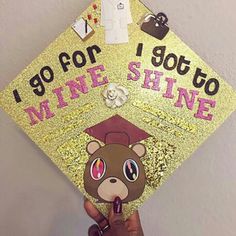 someone is holding up a graduation cap that says, i go for wine and shine