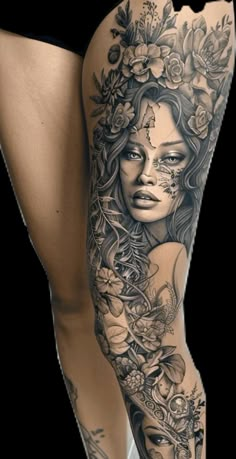 a woman's leg with tattoos and flowers on her body, in black and white