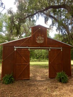 a barn with a chandelier hanging from it's roof