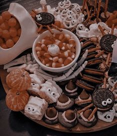 an assortment of halloween treats on a platter