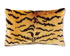 an animal print pillow on a white background