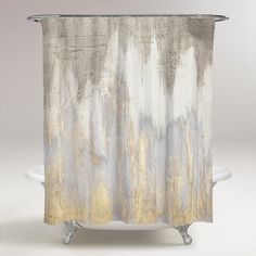 a shower curtain with yellow and white paint on it's side, in front of a gray background