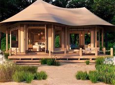 a gazebo sitting on top of a lush green field