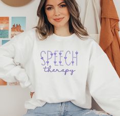 This speech therapy sweatshirt is the perfect gift for a speech therapist or speech language pathologist. It's made from a comfortable blend of polyester and cotton, so it's soft and easy to wear. The ribbed knit collar keeps its shape, even after washing, and there are no itchy side seams to worry about. Choose from our fresh white or retro Ash Grey color sweatshirts.  🌸How Do I Order 1. Before you place the order, please review all the information. 2. From the drop down menu, chose your crewneck color and size.  🌸G A R M E N T ∙ F E A T U R E S : *50% cotton, 50% polyester *Medium-heavy fabric (8.0 oz/yd² (271.25 g/m *Loose fit *Sewn-in label *Runs true to size 🌸Sizing Chart Use the sizing chart to understand the measurement our crewnecks   ✉️U.S. Shipment Time *5-7 Business Days afte Speech Teacher, Therapy Gift, Speech Language Pathologist, Teacher Sweatshirt, Speech Therapist, Speech Language Pathologists, Gift Cute, Support Small Business, Speech And Language