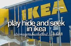 there is a sign that says ikea play hide and seek in ikea on the side of a building