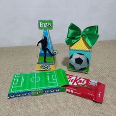 three different boxes with soccer themed items on them