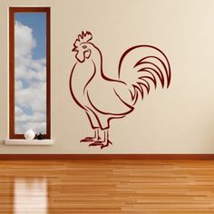 a rooster wall decal in a room with wood flooring and walls painted white