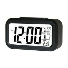 a black alarm clock with the time at 11 00 pm on it's display