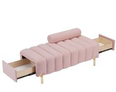 a pink couch that is sitting on top of a wooden bed with two drawers underneath it