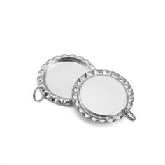 two round metal tags on a white background