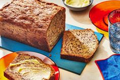 a loaf of bread sitting on top of a table next to two slices of bread